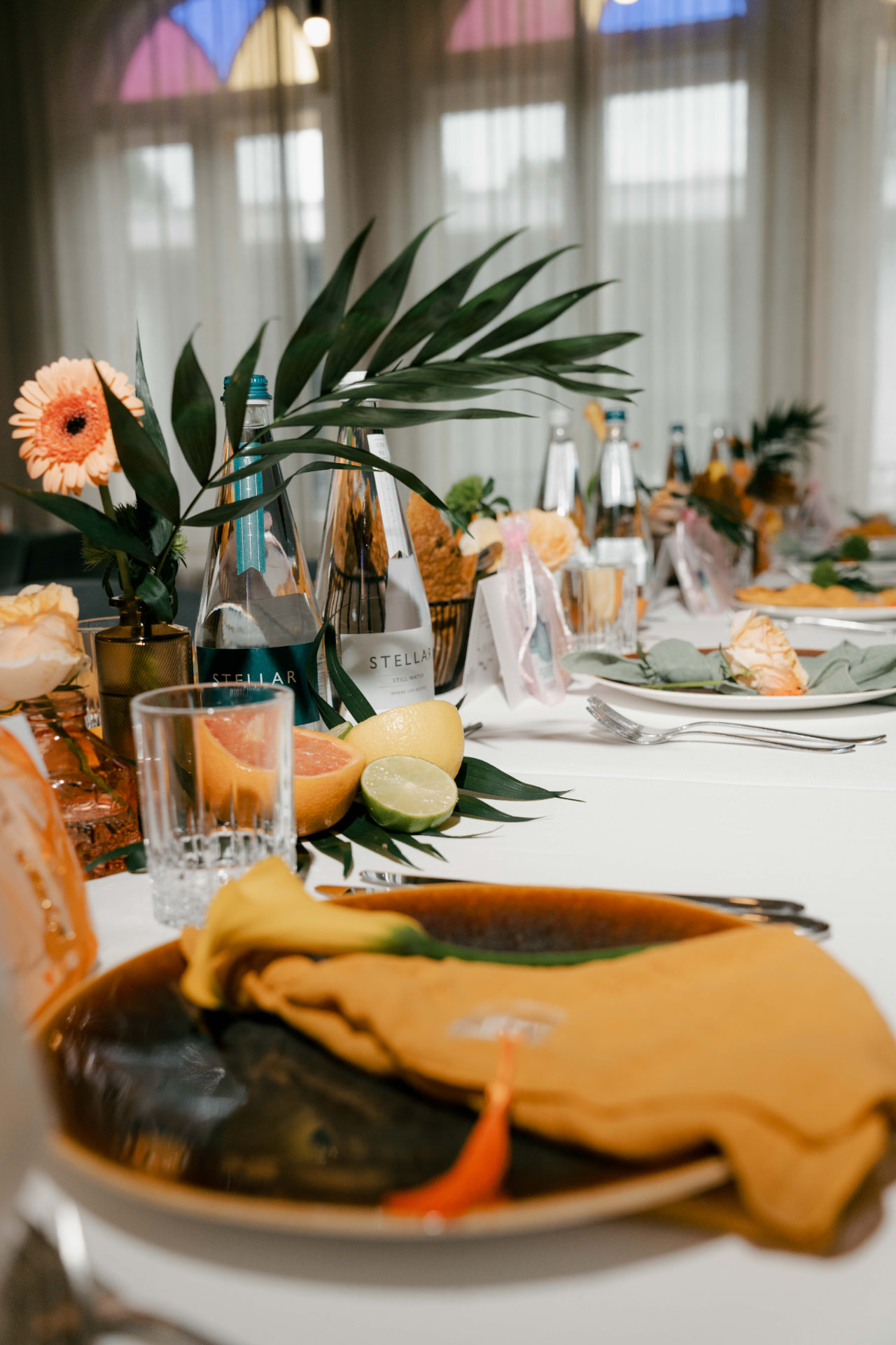 Elegant table setting with citrus and flowers