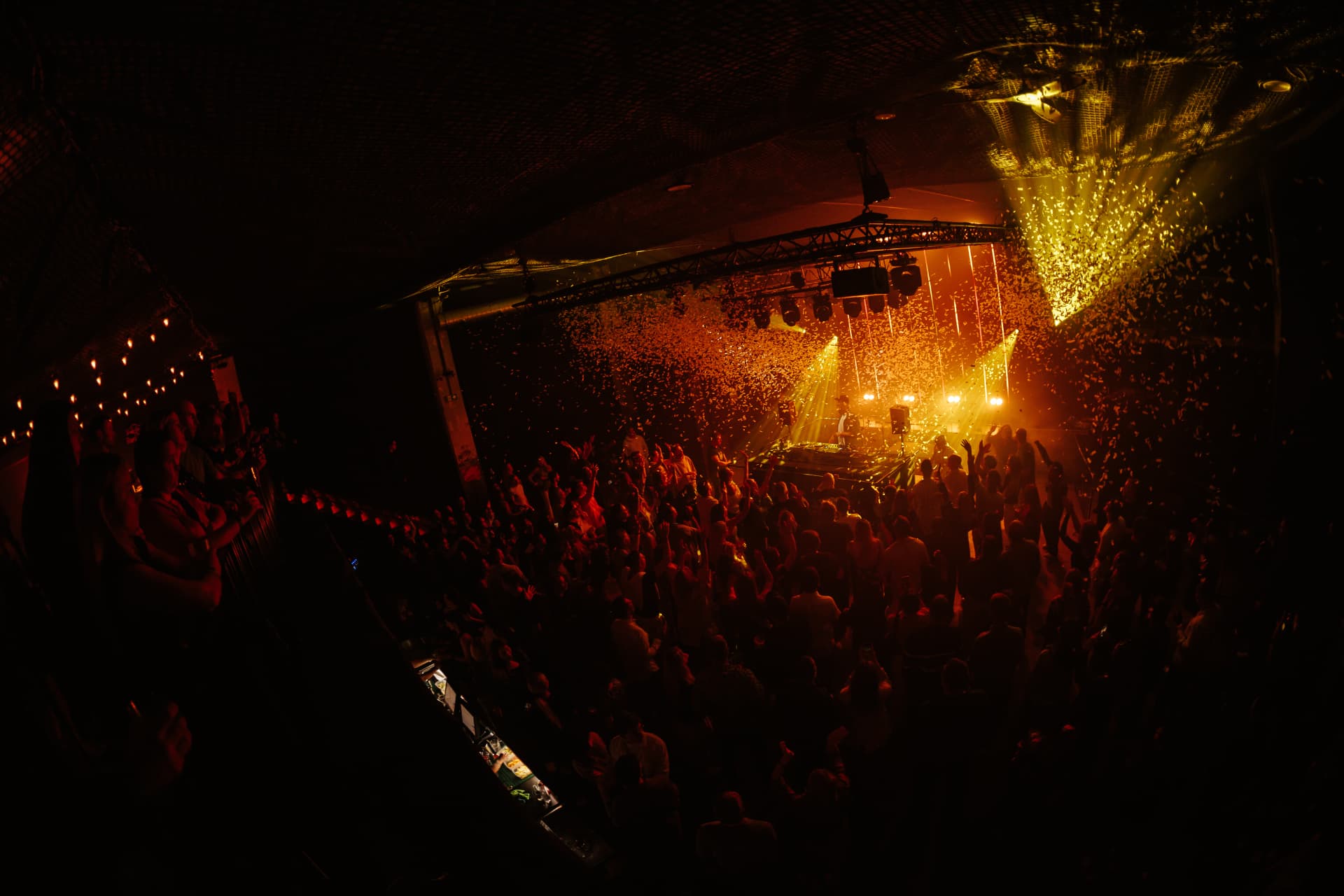 Confetti drop over a packed dance floor